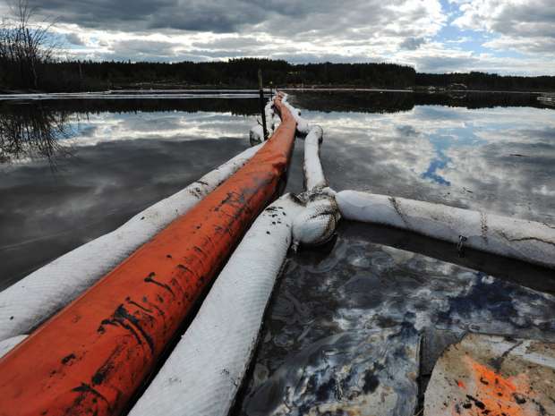 Oil on a marsh after it seeped up through a fissure under the water near Canadian Natural Resources' Primrose oilsands project in 2013.