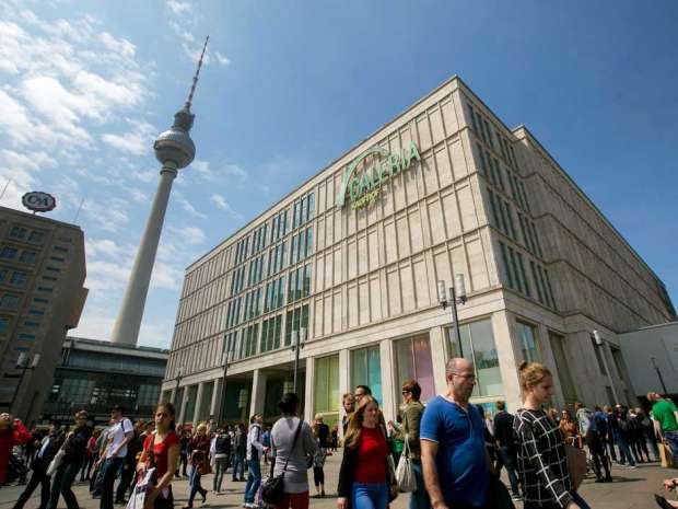 A Galeria Kaufhof sign sits on the side of a Galeria Kaufhof department store in Berlin.