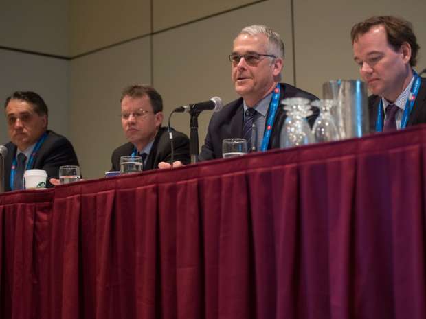 Rick McCreary (second from right), of TD Securities, speaks while Egizio Bianchini (left), of BMO Capital Markets, Peter Collibee (second from left), of Scotia Capital Inc. and David Shaver (right), of RBC Capital Markets, look on during a keynote session on global perspective in mining finance from the major Canadian banks at the 2016 PDAC (Prospectors & Developers Association of Canada) Convention in Toronto.