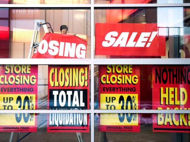 Signs at a Target on the first day of the company's closing liquidation sale in Toronto in February, 2015. 