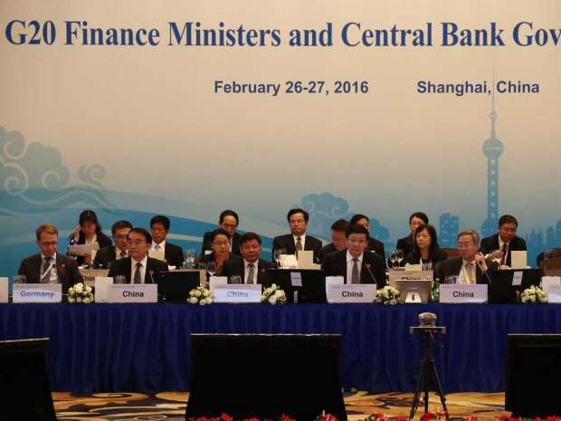 The chief of Germany's Bundesbank Jens Weidmann (Front-L), Chinese Deputy Finance Minister Zhu Guangyao (Front-3L), Chinese Finance Minister Lou Jiwei (Front-C), People's Bank of China Governor Zhou Xiaochuan (Front-2R) and Deputy Governor Yi Gang (Front-R) sit alongside delegates at the G20 Finance Ministers and Central Bank Governors Meeting in Shanghai on February 26, 2016. 