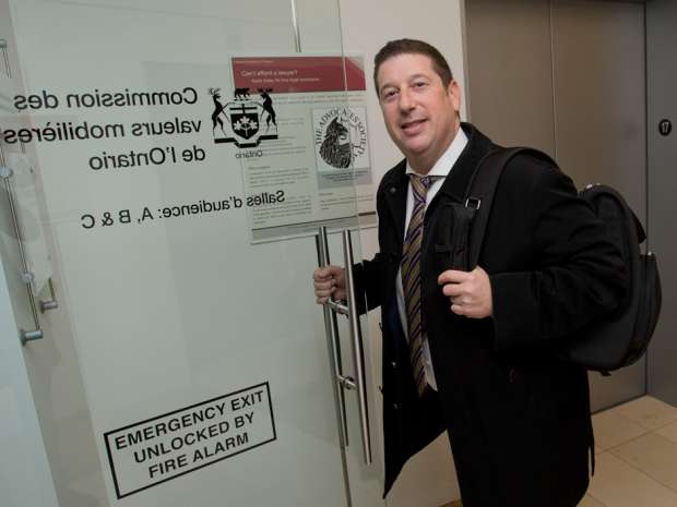 Paul Azeff, the frat brother of Mitch Finklestein, arrives at the Ontario Securities Commission October 31, 2014. 