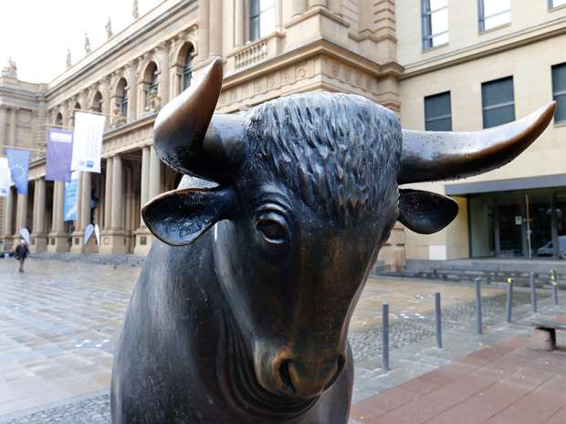 A bull statue stands in front of the stock market in Frankfurt, Germany. The London Stock Exchange and Deutsche Boerse and reportedly in talks to merge.