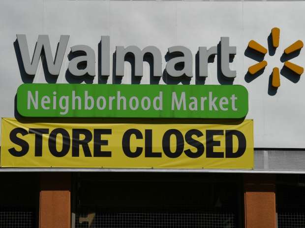 Wal-Mart Stores trimmed its sales forecast for fiscal 2017 due to store closures and the strong dollar as it reported lower fourth-quarter earnings.