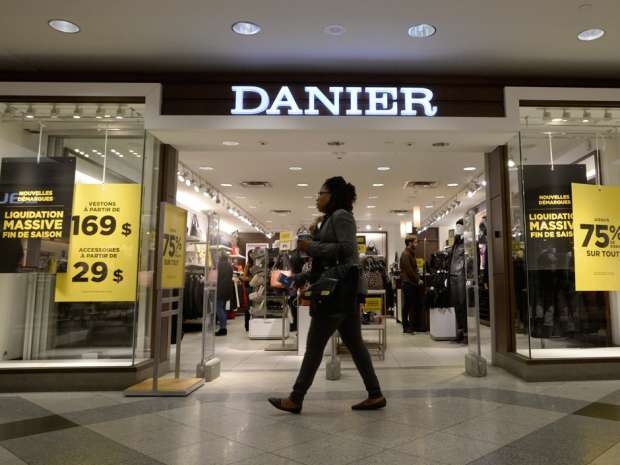 A woman walks past a Danier store in Montreal, Thursday, Feb.4, 2016. Danier Leather Inc. said it has entered insolvency proceedings in order to protect itself from creditor lawsuits as it seeks a buyer.