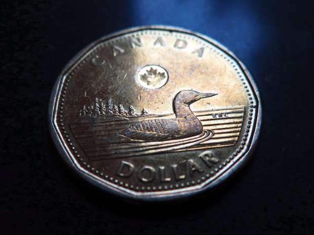 The loonie strengthened for its fourth day after January's GDP report said the the economy grew 0.6 per cent from a month earlier.